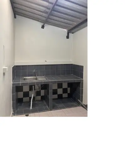 Simple kitchen with tiled countertop and open storage space