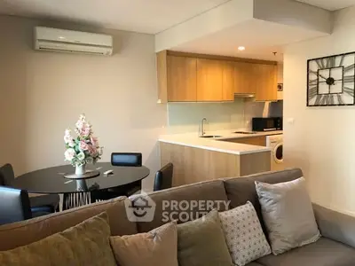 Modern living room with open kitchen and stylish decor