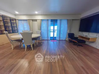 Spacious living room with elegant dining set and modern decor