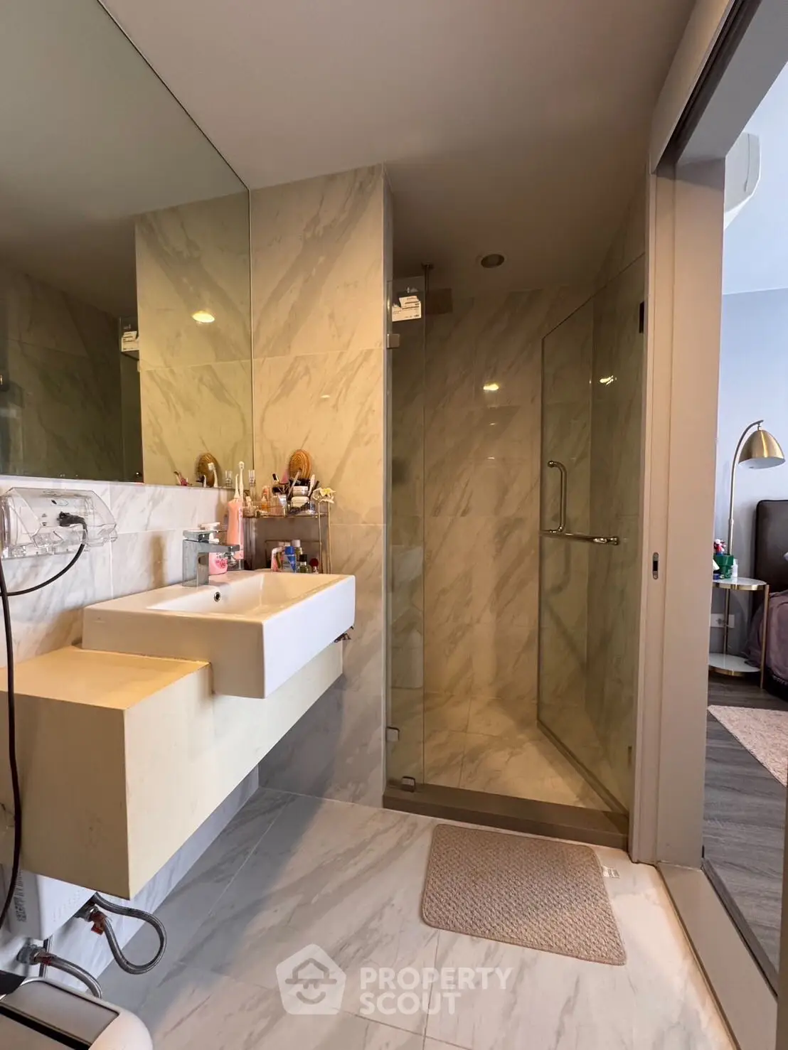 Modern bathroom with glass shower and sleek sink design