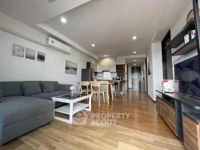 Spacious modern living room with open kitchen and stylish decor