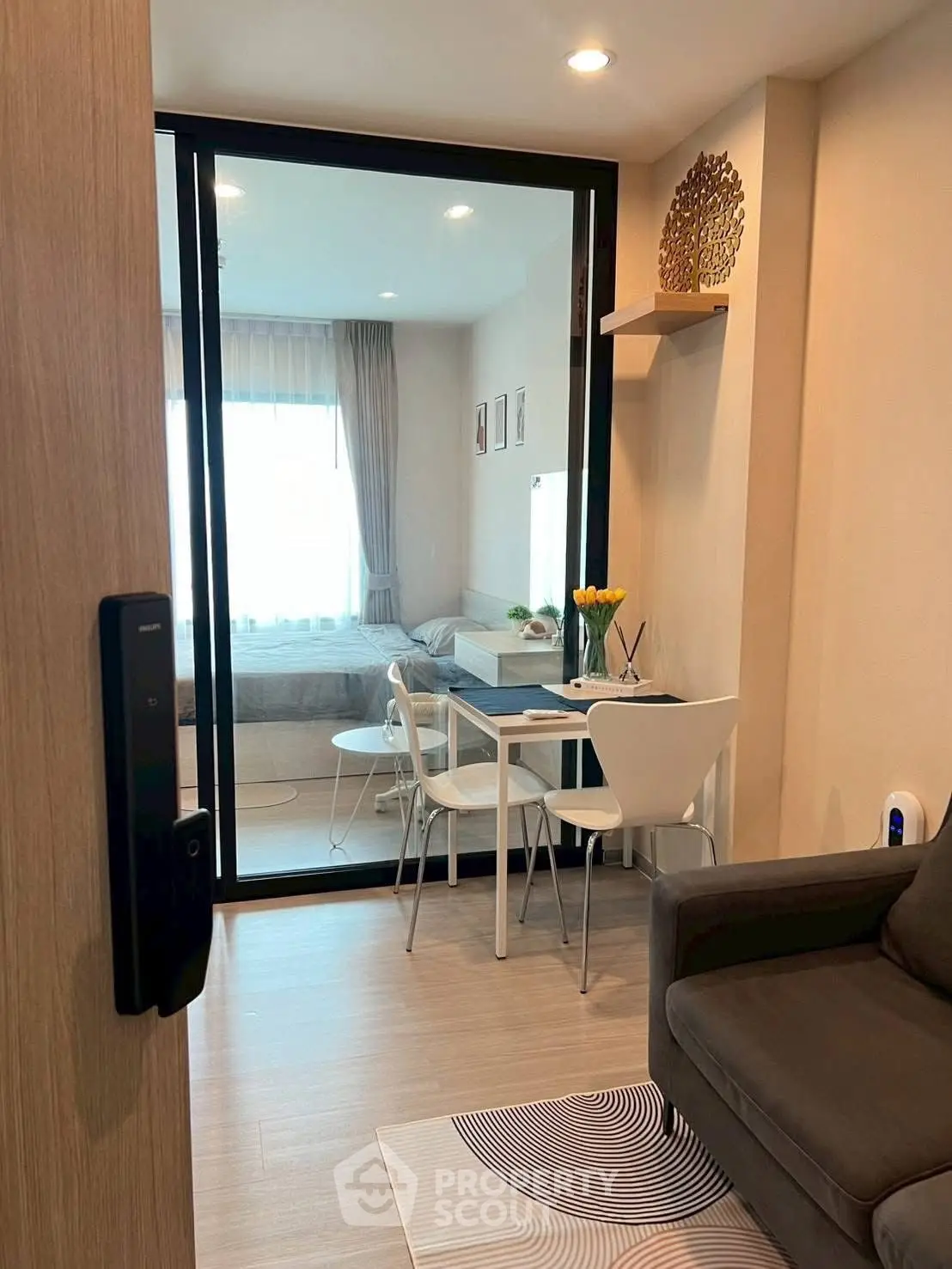 Modern apartment interior with cozy living area and dining space