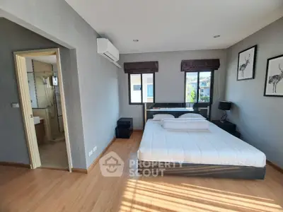 Modern bedroom with ensuite bathroom and stylish decor