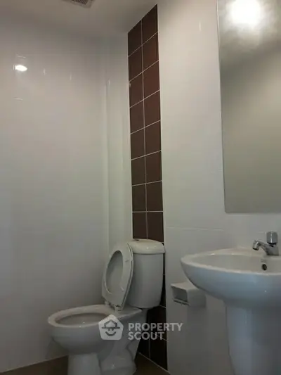 Modern bathroom with sleek fixtures and minimalist design.