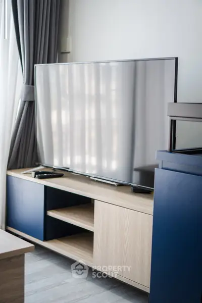 Modern living room with sleek TV unit and stylish decor
