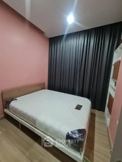 Cozy bedroom with modern design and comfortable bed in stylish apartment.