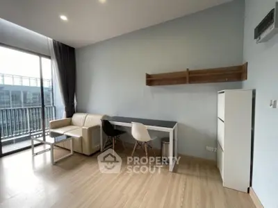 Modern living room with balcony access and stylish furniture