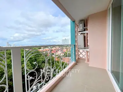 Spacious balcony with stunning city and greenery views, perfect for relaxation.