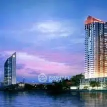 Stunning waterfront high-rise building with modern architecture and scenic views.