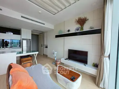 Modern living room with sleek design and open kitchen layout