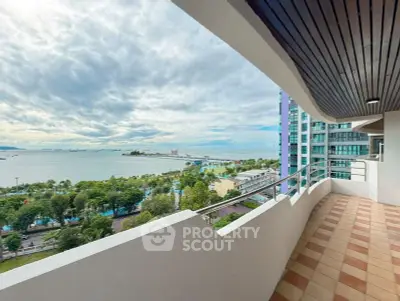 Spacious balcony with stunning ocean view in modern high-rise apartment