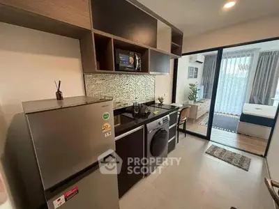 Modern kitchen with sleek appliances and open layout in stylish apartment