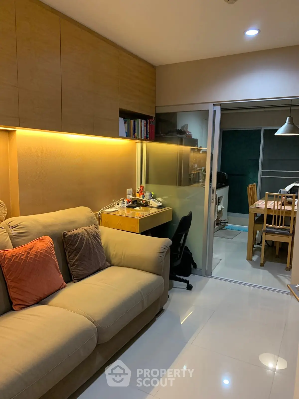 Cozy living room with modern decor and adjacent dining area