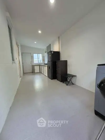 Spacious kitchen with modern appliances and open layout, perfect for culinary enthusiasts.