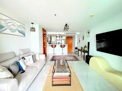 Spacious modern living room with stylish decor and open kitchen layout
