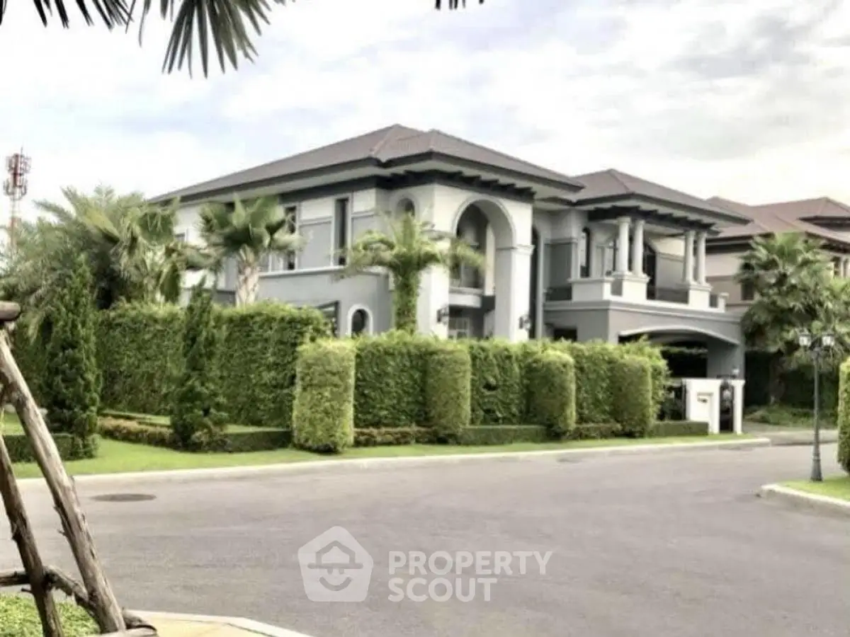 Luxurious modern villa with lush greenery and elegant architecture in a serene neighborhood.