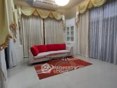 Elegant living room with stylish curtains and red-accented decor