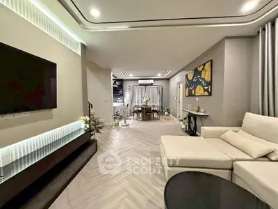 Spacious modern living room with elegant decor and open layout, perfect for entertaining.