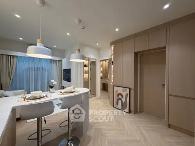 Modern open-layout kitchen with stylish dining area and cozy living room