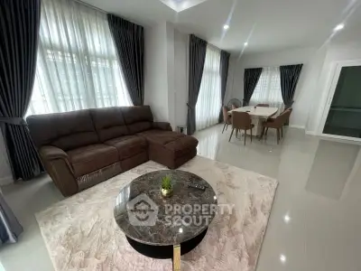 Spacious modern living room with elegant furniture and large windows