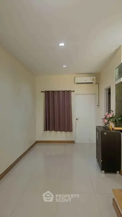 Minimalist interior room with air conditioning and elegant curtains