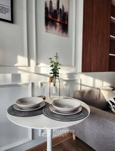 Chic modern living room with elegant dining setup and stylish decor