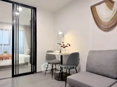 Modern apartment interior with cozy living area and stylish bedroom view.