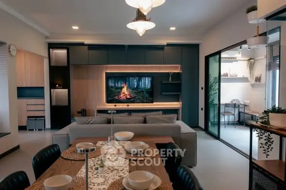 Modern living room with stylish decor and open layout dining area