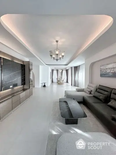 Luxurious modern living room with elegant lighting and spacious design