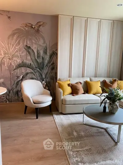 Stylish living room with tropical wallpaper and modern furniture, perfect for relaxation and entertaining.