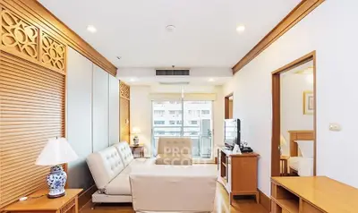Spacious living room with elegant wooden accents and modern furniture in a luxury apartment.