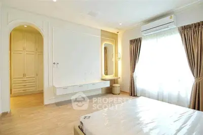 Spacious bedroom with elegant design and natural light