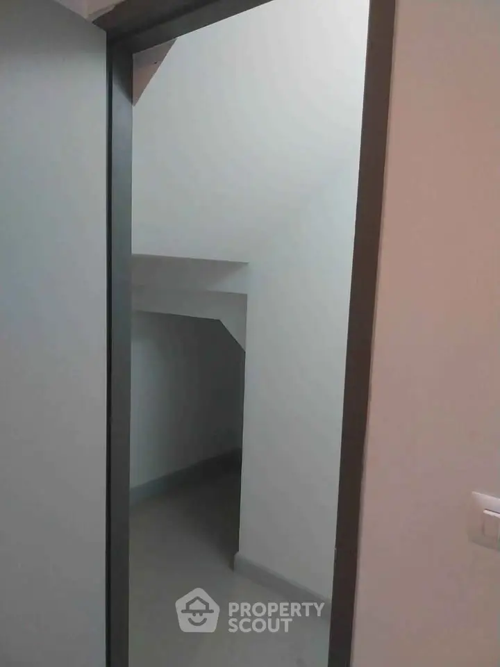 Compact storage space under stairs in modern home
