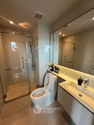 Modern bathroom with glass shower and sleek fixtures