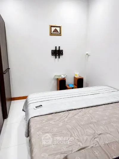Cozy bedroom with modern decor and ample storage space