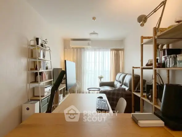 Cozy living room with modern decor and ample natural light