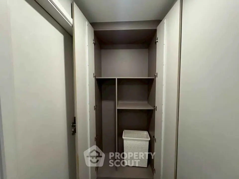 Spacious storage closet with modern design and ample shelving space.