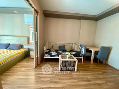 Cozy studio apartment with wooden flooring and modern furnishings