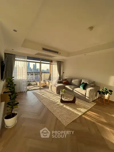 Spacious living room with modern decor and city view balcony