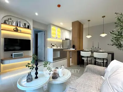 Modern open-plan living room and kitchen with stylish decor and lighting