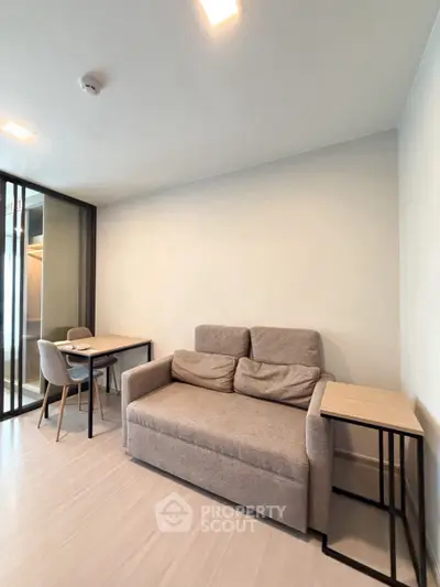 Modern living room with cozy sofa and dining area in a stylish apartment