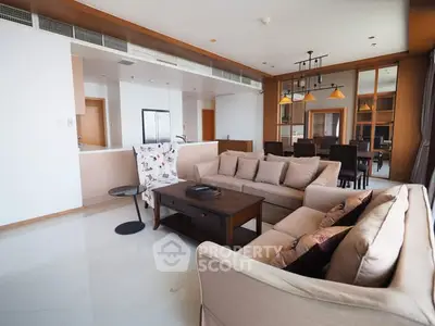 Spacious modern living room with elegant decor and open kitchen layout
