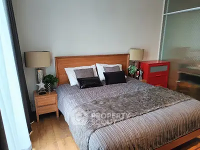 Cozy bedroom with stylish decor and wooden furniture