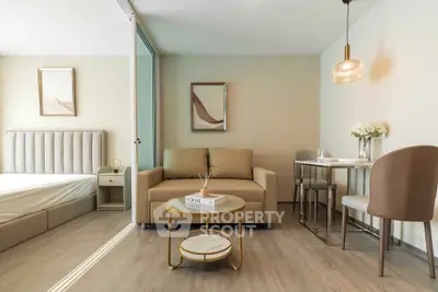 Modern studio apartment with stylish living area and cozy bedroom