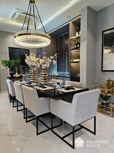 Luxurious dining room with elegant chandelier and modern decor