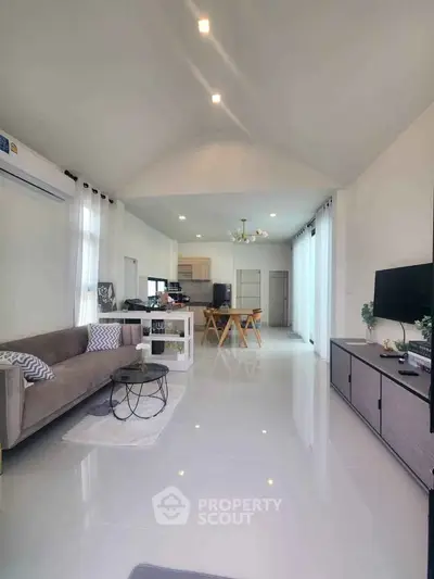 Spacious modern living room with open kitchen and elegant decor