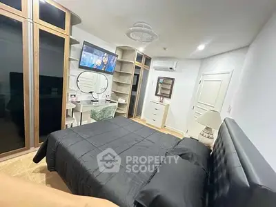 Modern bedroom with sleek black bedding and stylish furniture