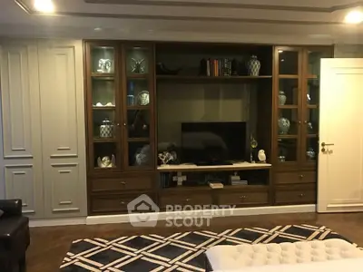 Luxurious living room with elegant built-in shelving and modern decor