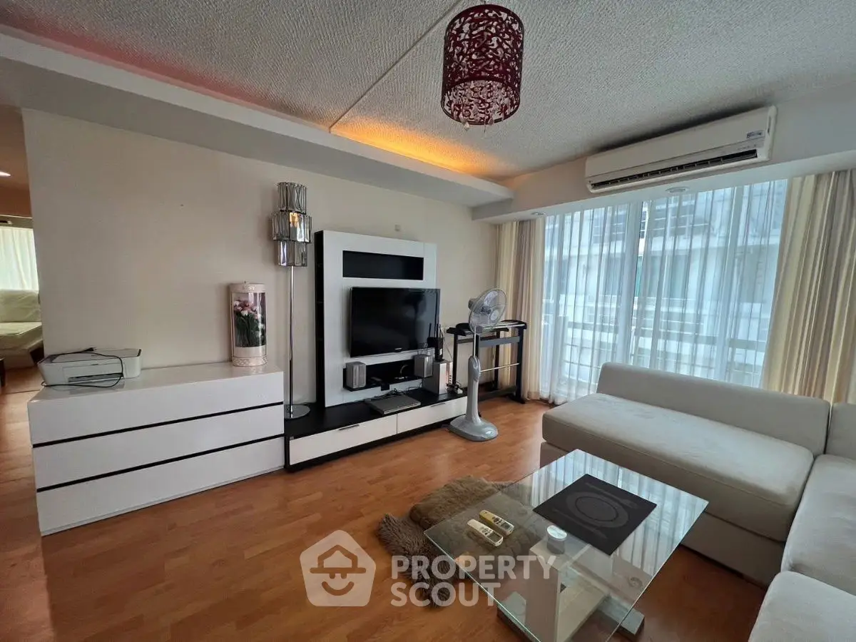 Spacious modern living room with stylish decor and natural light