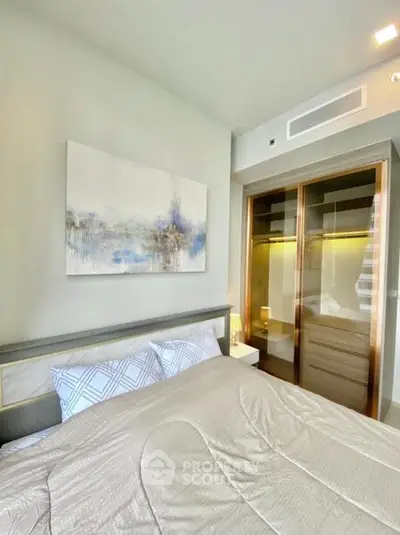 Modern bedroom with stylish decor and built-in wardrobe